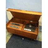 A teak cased Hi-Fi unit, containing a Garrard turntable, a Quad Amplifier and a Quad tuner