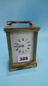 A small brass four glass carriage clock