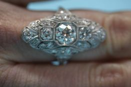 A Continental white metal and diamond cluster ring, size P/Q, 7.7 grams