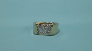 An '18kt' gold and diamond signet ring, missing 1 stone, 8.4 grams