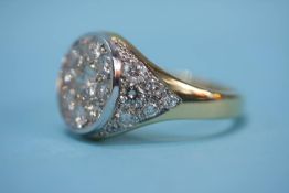 An 18ct gold and diamond signet ring, the central diamond approx. 0.5ct