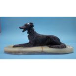 A model of a dog on an onyx base, 46cm length