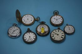 A collection of various pocket watches, some silver