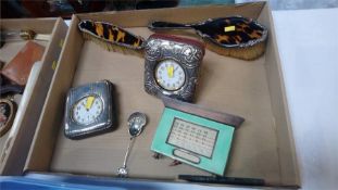 Two silver mounted watch cases, an enamelled silver desk calendar etc.