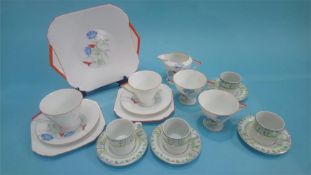 A 1930's Art Deco Shelley tea set, pattern number 2195, decorated with flowers and having triangular