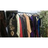 A rail of evening dresses