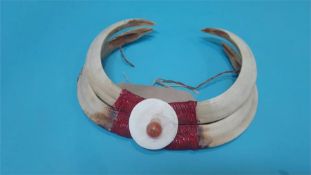 A Naga tribal boars tusk necklace