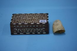 An Indian hardwood box containing a scrimshaw tooth 12 cm length