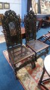 A pair of carved oak barley twist hall chairs, with cane back and seats