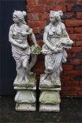 Two garden statues on plinths