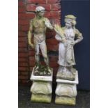 Two garden statues on plinths