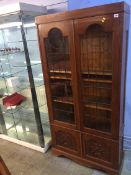 An oak leaded glass bookcase, 89cm wide
