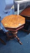 A Victorian octagonal top sewing table