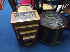 Oriental carved nest of tables and an octagonal table