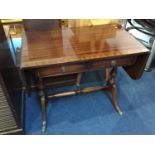 A reproduction mahogany sofa table