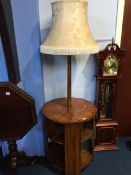 An Art Deco walnut circular lamp table