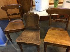 A pair of chairs and an oak hall chair
