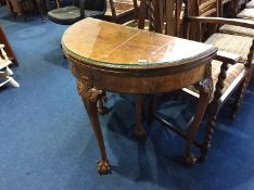 A walnut Queen Anne style half moon card table