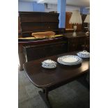 An Ercol refectory table and dresser.