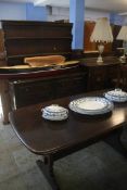 An Ercol refectory table and dresser.