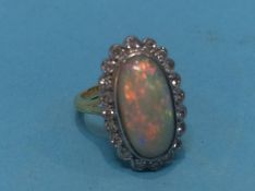 An opal set ring, stamped '18ct' size 'G', 4.6grams