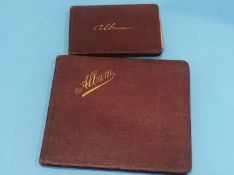 Two autograph albums containing various notes and visitor caricatures etc.