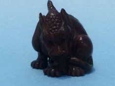 A carved netsuke in the form of a dog of Fo