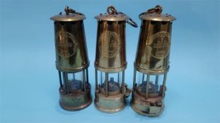 Three Eccles miners lamps