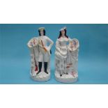 A pair of Staffordshire flatbacks of a Scottish lady and Gentleman, 40cm height