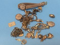 Various gold charms, a gold ladies watch etc.
