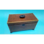 A 19th century mahogany tea caddy, with satinwood banding, supported on turned feet