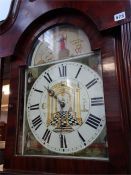 A mahogany long case clock with Masonic dial and 30 hour movement