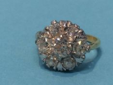 A diamond cluster ring stamped '18ct', size 'N' (approx.) 4.8 grams