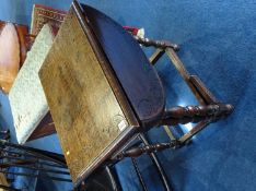 A carved oak gateleg table