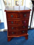 A small serpentine chest of drawers, 40cm wide