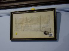 A framed indenture, bears date 1614, 11x29cm