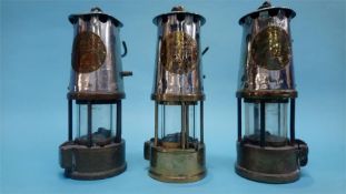Three Eccles miners lamps