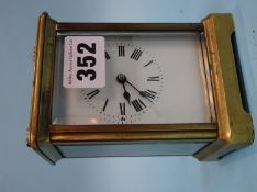A brass four glass Carriage clock, French movement, unsigned dial