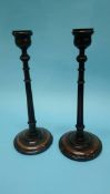 A pair of wooden candlesticks, 34cm height