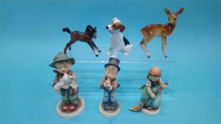 Three Hummel figures, a Doulton dog etc.