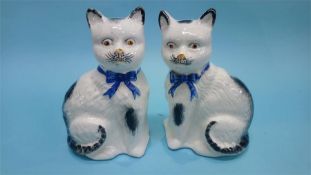 A pair of Staffordshire cats