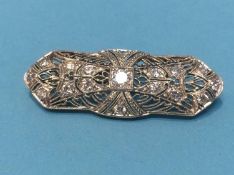 A diamond set white metal brooch