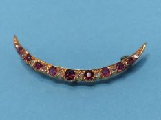 A 15ct gold diamond and ruby set brooch, 3.5 grams, approx. 47.1mm