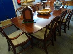 A mahogany double pillar reproduction dining table and eight chairs (6+2), 212x98cm, including leaf