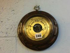 An oak cased barometer