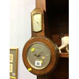 An oak cased barometer