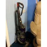 A Dyson DC25 upright vac