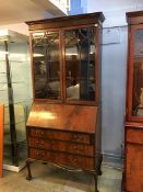 A mahogany bureau bookcase