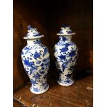 A near pair of Oriental lidded vase
