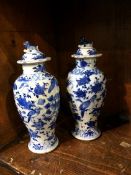 A near pair of Oriental lidded vase